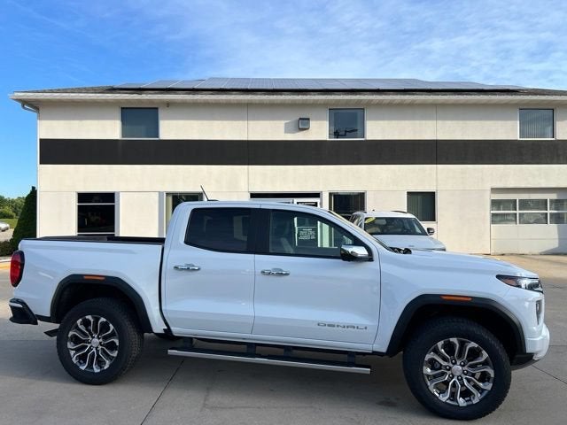 2026 GMC Canyon Denali in Summit White — front three-quarter view